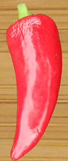 Red chile on  wooden cutting board